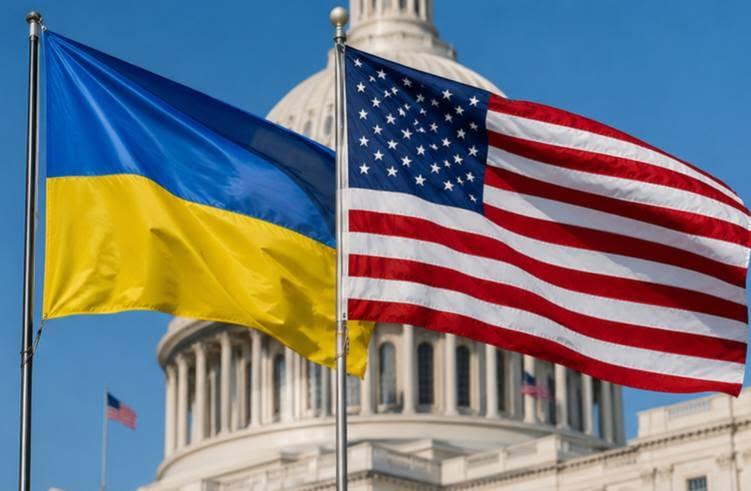 Ukrainian and American flags flying together in front of the U.S. Capitol