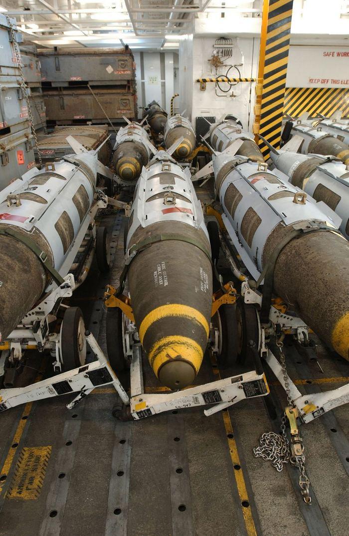 JDAM precision-guided munitions staged aboard a U.S. Navy aircraft carrier